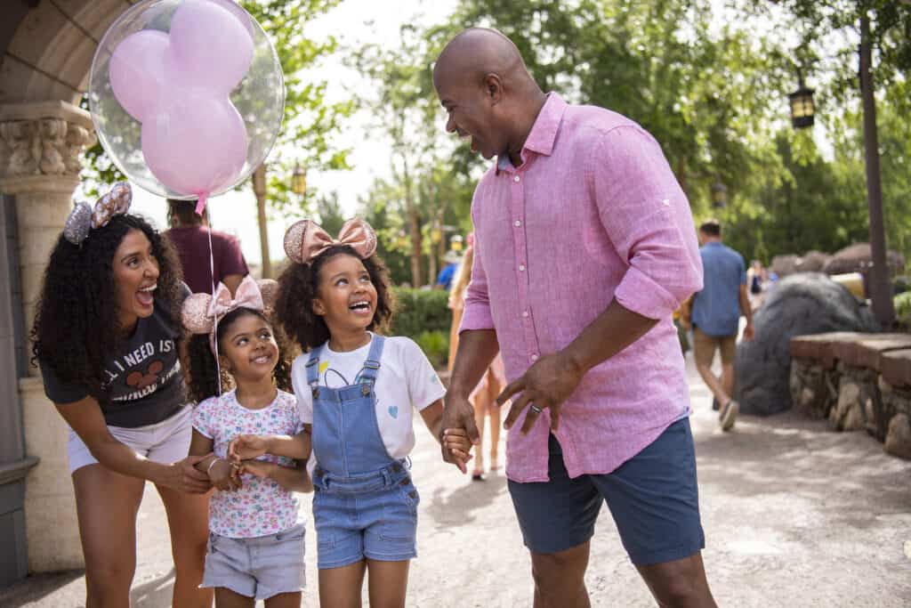 Family smiling enjoying Walt Disney World