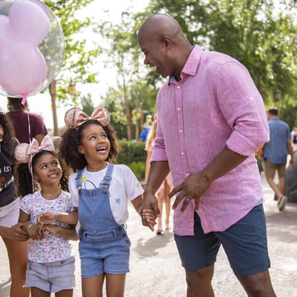 Family smiling enjoying Walt Disney World