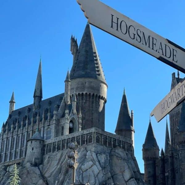 Photo of Hogwarts Castle and sign for Hogsmeade located in Universal Studios Florida