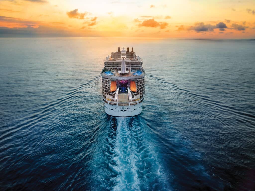 Allure of the Seas, aerials, rear view overhead of ship, horizon, sunset in background, Royal Caribbean Cruise