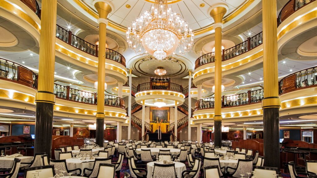 Grand view of Main Dining Room of a Royal Caribbean ship- 3 floors and large chandelier