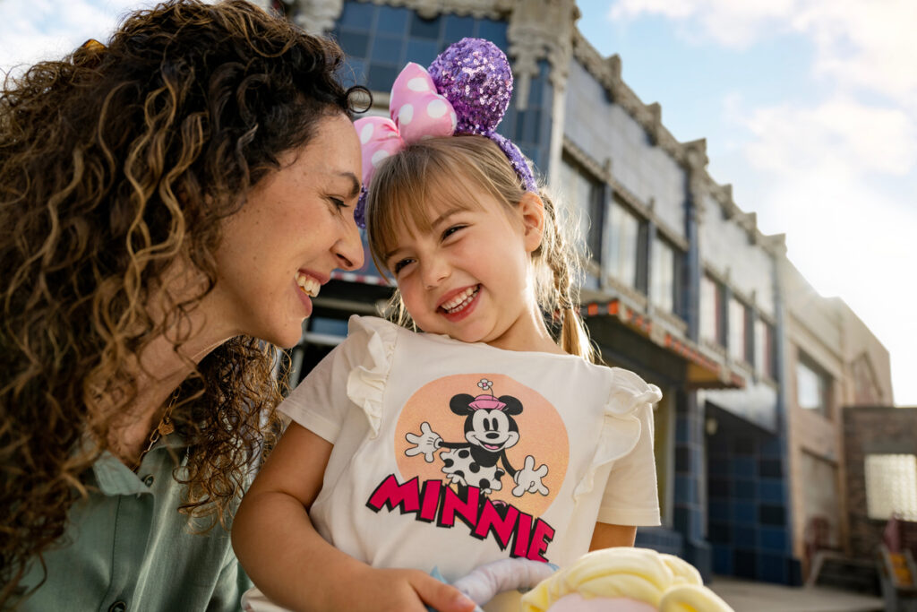 Mom and daughter smiling on Disneyland trip