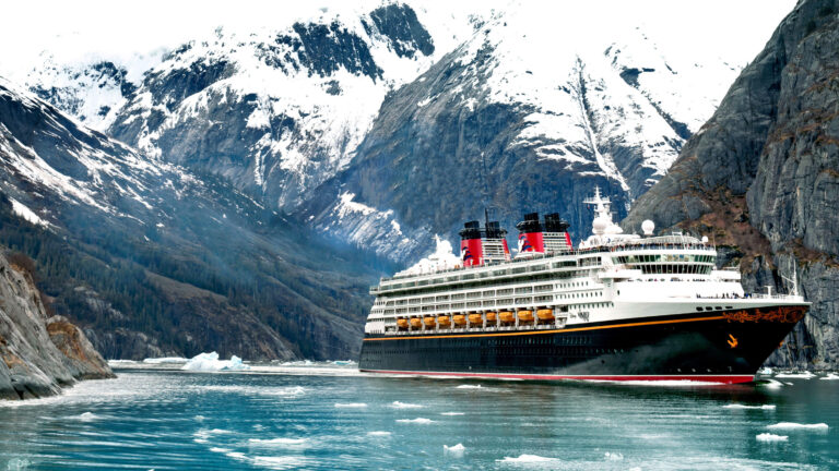 Disney Cruise Ship the Disney Wonder sailing in Alaska with glaciers in background
