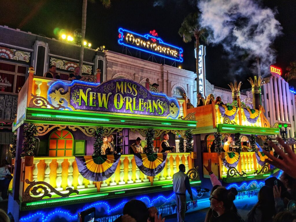 Vibrant picture of Mardi Gras float at night at the Universal Orlando Mardi Gras parade