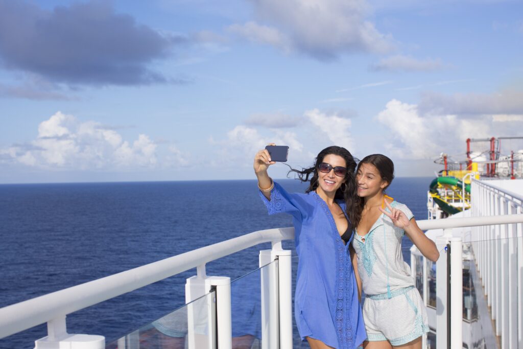 Mom and daughter talking a selfie on a Norwegian cruise ship