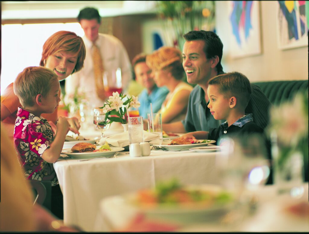 Young Family dining in Aqua restaurant on NCL cruise