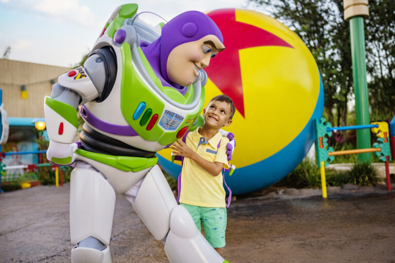 Buzz Lightyear hugs little boy during a character meet at Disney's Hollywood Studios