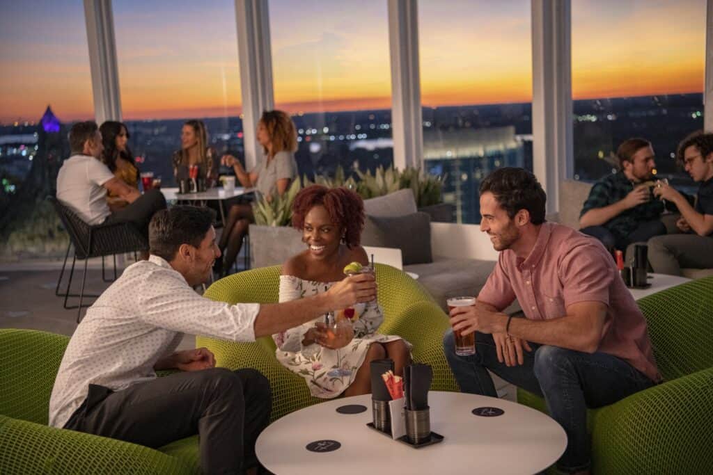 Guests enjoying Universal Aventura Hotel rooftop bar, Bar 17