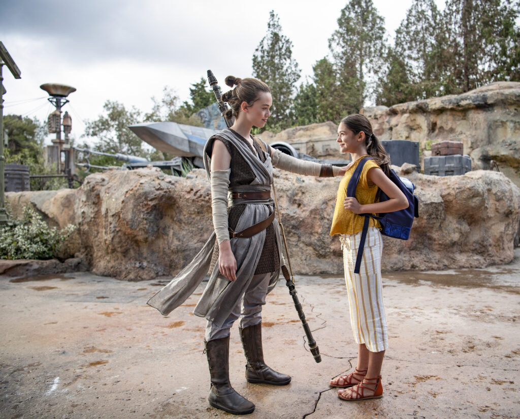 Girl meeting Rey during Disneyland trip character meet