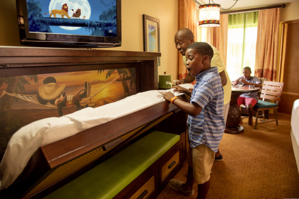 little boy pulling down murphy bed at Disney's Caribbean Beach Resort