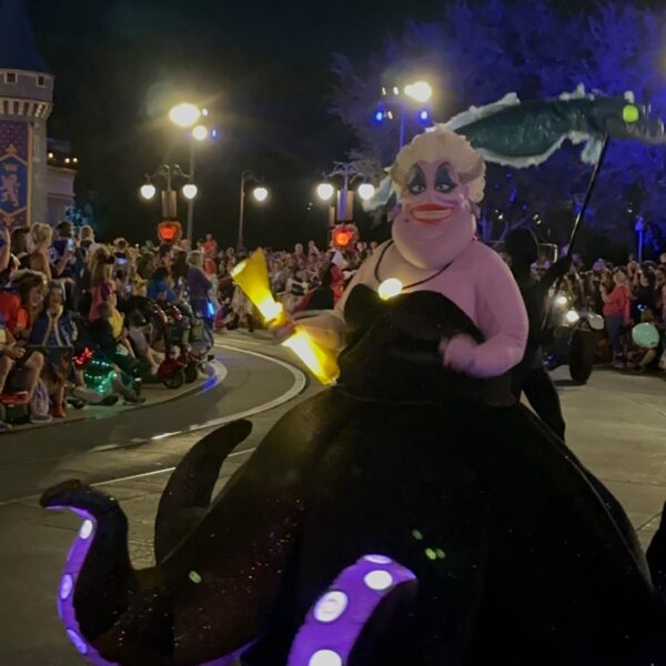 Disney Villain Ursula the Seawitch glowing and moving along the MNSSHP Party parade route in Walt Disney World
