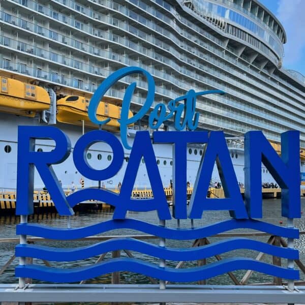 Port of Roatan sign with Royal Caribbean Harmony of the seas behind photo