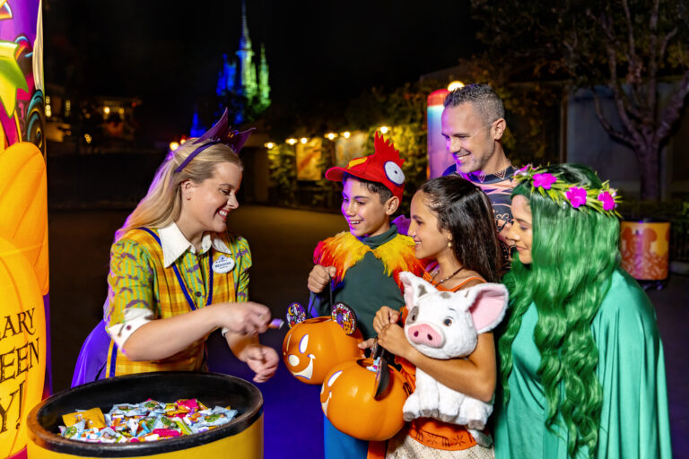 Disney Cast Member and Trick or Treating guests at Mickey's Halloween party