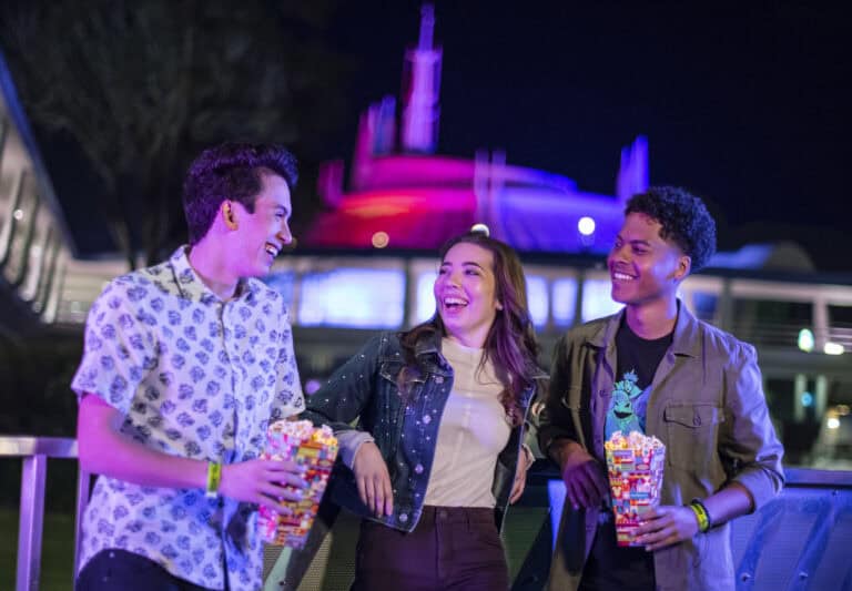 Disney Adults enjoying Disney After Hours with snacks at Magic Kingdom