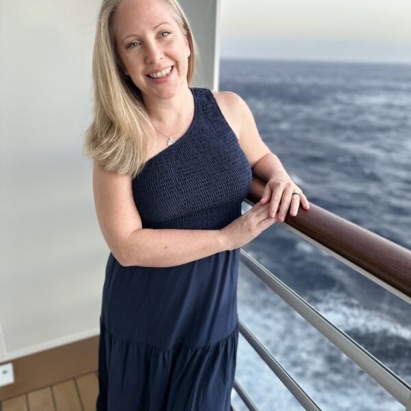 Christy Slavik, Travel Agency owner on balcony of cruise ship