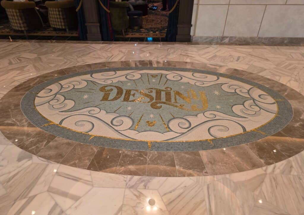 Tilework of the floor onboard the Disney Destiny with the Disney Cruise ship logo